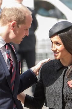 a man and woman standing next to each other