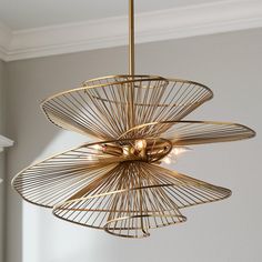 a gold chandelier hanging from the ceiling