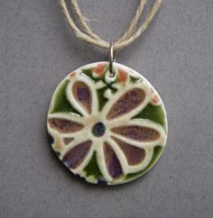 a necklace with a flower design on it