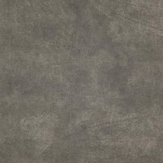 a close up view of the surface of a gray leather textured material background or wallpaper