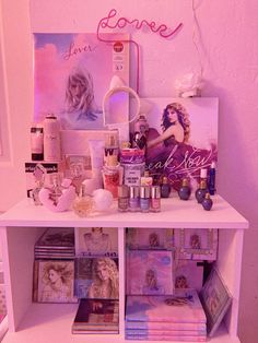 a white shelf filled with lots of cosmetics and personal care items next to a pink wall