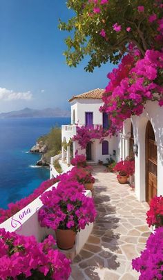 an image of a beautiful house with flowers on the side