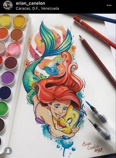 the little mermaid has been drawn with watercolors and is ready to be colored