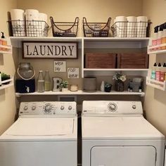 a washer and dryer in a laundry room with baskets on the shelves above them