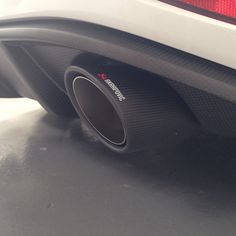 the rear end of a car with exhaust pipe