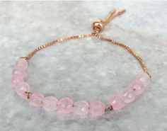 Rose Gold Plated slide clasp bracelet with rose quartz gemstone beads. Handmade bracelet using 6mm faceted rose quartz beads on box chain with an easy adjustable slider clasp. Rose Quartz known as the love stone. It is believed to encourage harmony in relationships, promotes peace, trust, self love, compassion and kindness. All the Semi Precious Gemstones I use are genuine and they have their own natural characteristics, unique colouration and may have some minor imperfections. This is handmade Bracelet Rose Gold, Quartz Gemstones, Rose Bracelet, Rose Quartz Bracelet, Clasp Bracelet, Rose Quartz Beads, Rose Quartz Gemstone, Quartz Beads, Stackable Bracelets