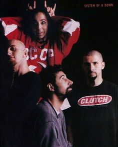 a group of men standing next to each other in front of a black background with the words system of a down on it