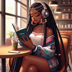a woman sitting at a table with headphones on reading a book and listening to music