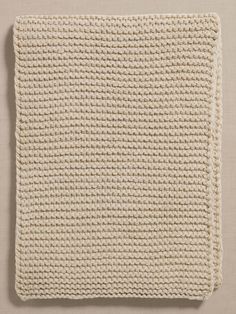 a crocheted dishcloth on a white surface