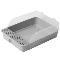 a white plastic container with perfored holes on the front and bottom, for food storage