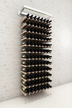 a wine rack with many bottles in it and a video play button on the bottom