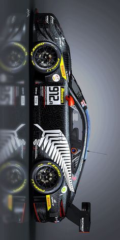 the front end of a race car with wheels on it's sides and numbers painted on