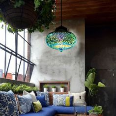 a living room filled with lots of furniture next to a planter on the wall