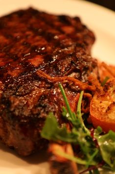 a piece of steak and some vegetables on a plate