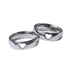 two silver rings with hearts on them