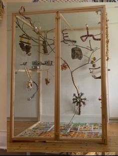 a display case filled with lots of necklaces and bracelets hanging from it's sides