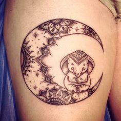 a woman's thigh with an elephant sitting on the moon