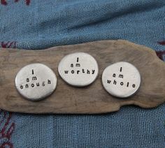three buttons that say i am worthy, i am enough and i am whole