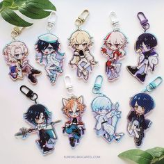 six anime keychains with various characters on them and one is holding a knife