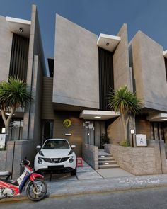 a white car parked in front of a building next to a motor scooter