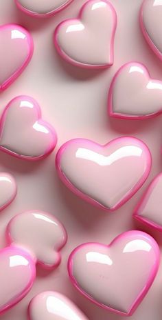 pink and white heart shaped candies are arranged in the shape of hearts