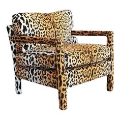 a leopard print chair with arms and legs