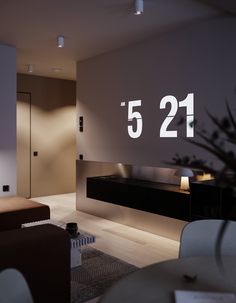a living room filled with furniture next to a wall mounted sign that reads 521