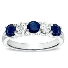 Three radiant round-cut natural blue sapphires and two white diamonds sparkle as they alternate lending dazzle to your reminder of commitment. Designed by Suzy Levian, this 14k white gold eternity ring features a high polish finish. Beautiful on it's own or perfectly stackable with another Suzy Levian design, this flawless, elegant design comes with endless fashion possibilities. It's the perfect gift for any occasion. This ring is eye-catching on its own or can also be worn with your engagement ring. Remind yourself of your love and commitment every time you look at this elegant ring. This ring packs an impressive amount of elegance into its sturdy prong settings. The low profile keeps your gems safe and prevents snagging on fabrics. Diamonds InformationDiamond cut: RoundDiamond weight: 1 Diamond Anniversary Rings Eternity Bands Blue Sapphire, Diamond Sapphire Wedding Band, Diamond And Saffire Engagement Rings, Sapphire And Diamond Wedding Band, Diamond And Sapphire Wedding Band, Diamond Sapphire Ring, Gold Eternity Ring, Sapphire And Diamond Band, Trilogy Engagement Ring