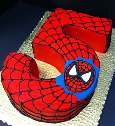 a spiderman cake with the words how to make spiderman cake decorations