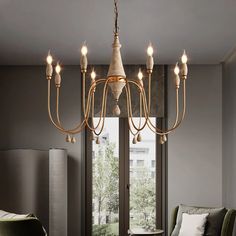 a chandelier hanging from the ceiling in a living room