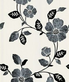 a black and white flower pattern on a wall