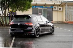 a black volkswagen golf gtr parked in a parking lot