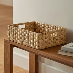 a basket sitting on top of a wooden table