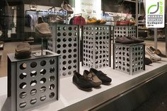 several pairs of shoes are on display in a store