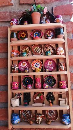 a wooden shelf filled with lots of colorful items