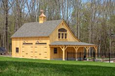 a large wooden building with a steeple on top