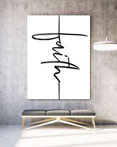 a white wall with a black and white abstract painting on it's right side