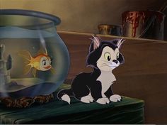 a cartoon cat sitting next to a fish bowl