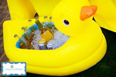 an inflatable ducky with beer bottles and ice