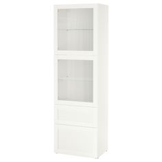 a tall white cabinet with two glass doors