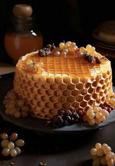 a cake with honeycombs and berries on it