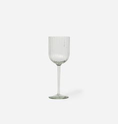 a clear wine glass on a white background