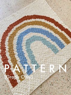 a crocheted rug with a rainbow design on the front and bottom, along with text that reads pattern