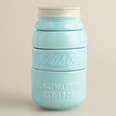 a blue mason jar with the words glassware co est 1900 on it's lid