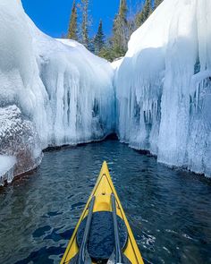 A yellow sea kayak in front of ice on Lake Superior in the winter, kayaking on Lake Superior in the winter What To Wear For Winter, Apostle Islands National Lakeshore, Lake Kayaking, Recreational Kayak, Glacier Bay National Park, Best Tents For Camping, Backcountry Skiing, Kayak Adventures