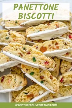 there is a plate full of cookies with white frosting