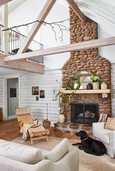 a living room filled with furniture and a fire place