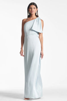 The Chelsea gown is an example of balance by design. A sleek sleeve of crinkle georgette is cut on the bias with an asymmetric seam at the waist, creating a column for curves. At the shoulder sits a hand-tucked, stitched-on collapsed bow. We design all of our Essential Social dresses with the intention that they can be enjoyed again and again. After all, a beautiful dress should be worn often and well. Birdy Grey Dresses, Light Blue Mother Of The Bride Dress, Blue Mother Of The Bride Dress, All White Bridesmaid Dresses, Blue Formal Dress Long, Light Blue Bridesmaid Dress, Sister Of The Bride Dress, Strapless Bridesmaid Dresses, Bridesmaids Blue