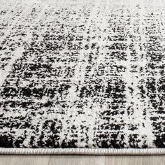 a black and white rug on the floor