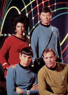 the cast of star trek from left to right, captain kirken, and spock